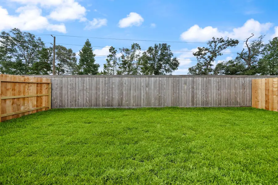Front exterior of a new home in , Conroe, TX, highlighting curb appeal (Image 2).