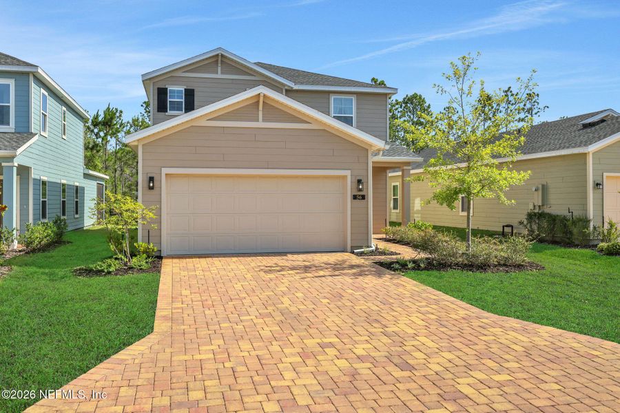 Front exterior of a new home in St Augustine Lakes, St. Augustine, FL, highlighting curb appeal (Image 2). Front exterior of a new home in St Augustine Lakes, St. Augustine, FL, highlighting curb appeal (Image 2).