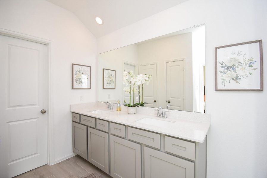 A spa-like bathroom with dual vanities and a modern design for ultimate relaxation