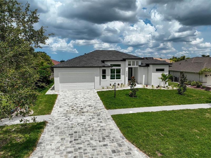 Front exterior of a new home in , North Port, FL, highlighting curb appeal (Image 26).