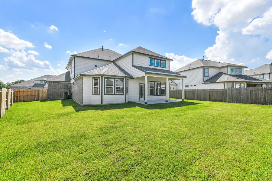 Exterior details and patio area of a home in Stone Creek Ranch, Hockley (Image 25).