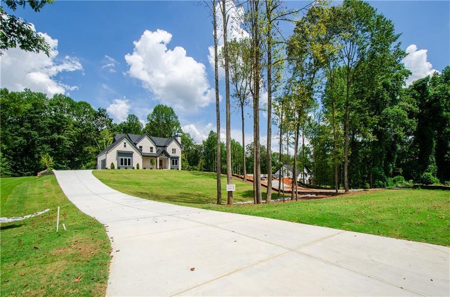 Front exterior of a new home in , Hoschton, GA, highlighting curb appeal (Image 25). Front exterior of a new home in , Hoschton, GA, highlighting curb appeal (Image 25).