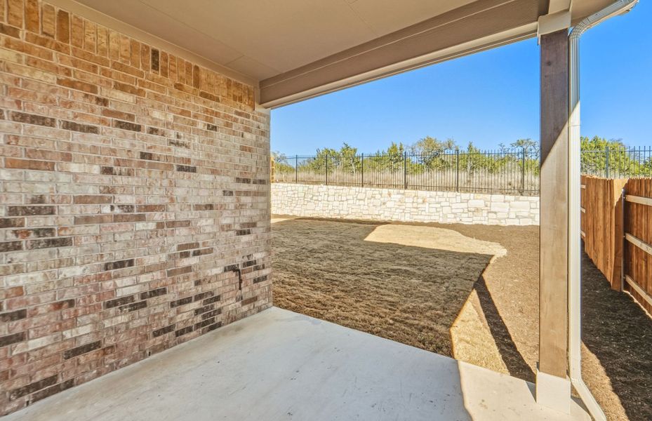 Exterior details and patio area of a home in West Cypress Hills, Spicewood (Image 3).