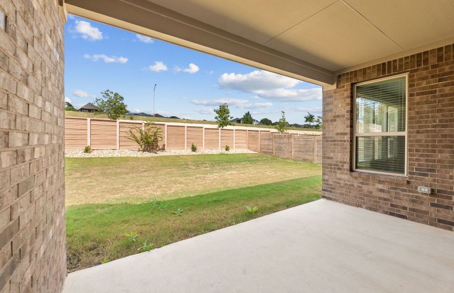 Exterior details and patio area of a home in Bluffview Reserve, Leander (Image 24).