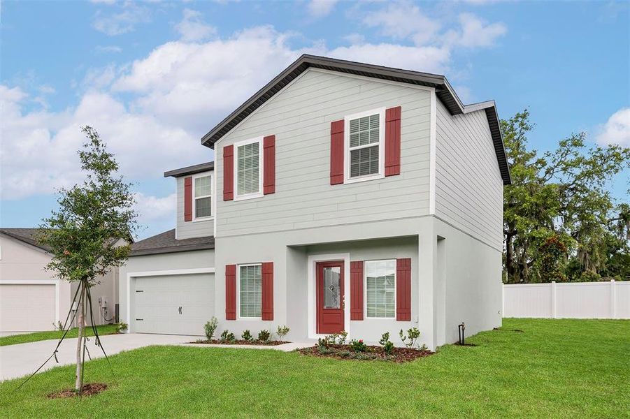 Front exterior of a new home in Tula Parc, Astatula, FL, highlighting curb appeal (Image 2).