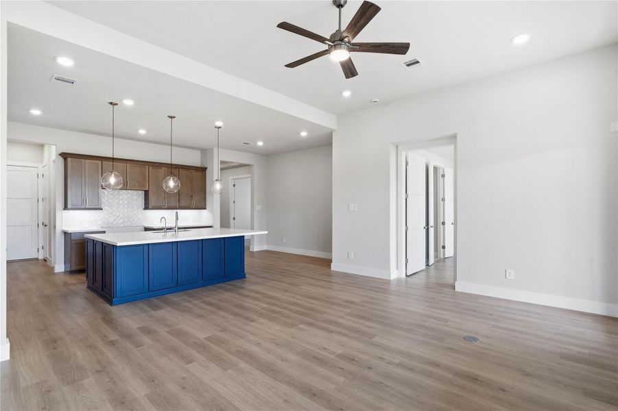 Whether you are relaxing in the great room or greeting guests at the front door, the open sightlines ensure that everyone feels connected, fostering a truly inclusive living experience where isolation is a thing of the past.