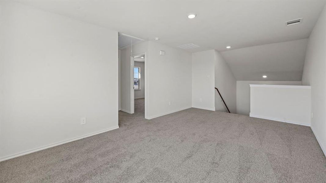 Bonus room featuring attic access, light colored carpet, recessed lighting, and vaulted ceiling