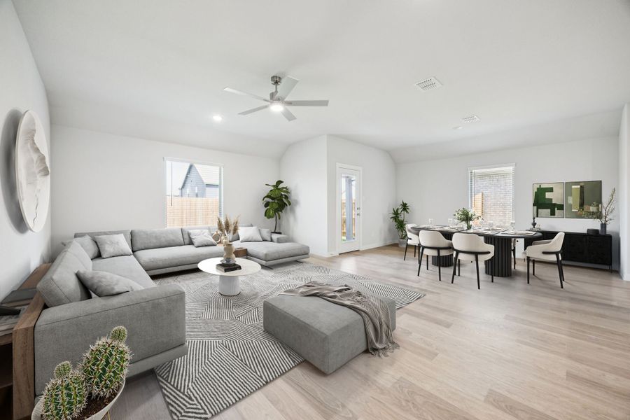 Dining and Living Room in the Harrison home plan by Trophy Signature Homes – REPRESENTATIVE PHOTO