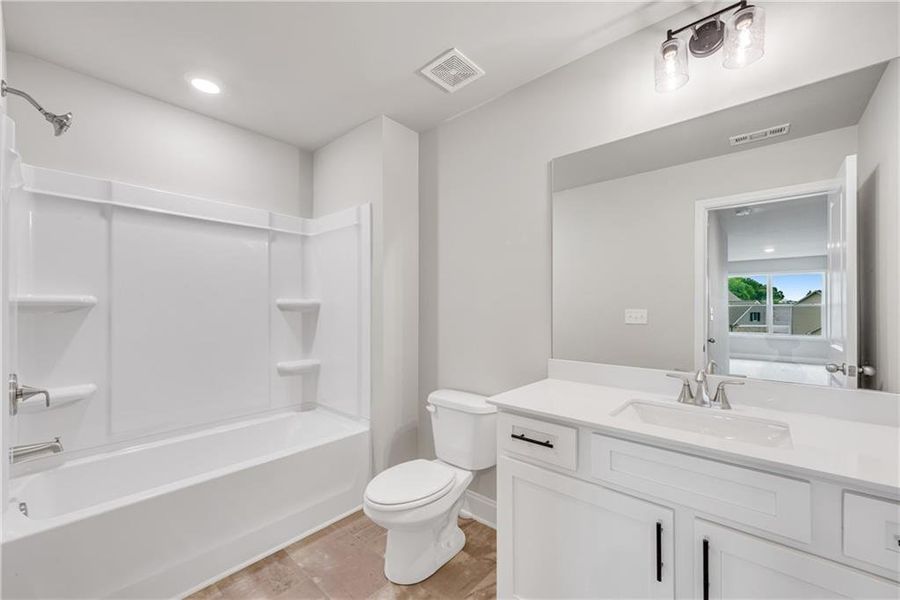 Furnished interior view inside a new home in Hidden Fields, Hoschton (Image 10).
