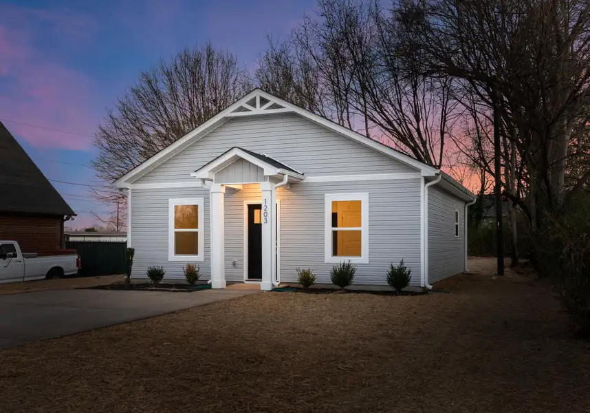 Front exterior of a new home in , North Charleston, SC, highlighting curb appeal (Image 2). Front exterior of a new home in , North Charleston, SC, highlighting curb appeal (Image 2).