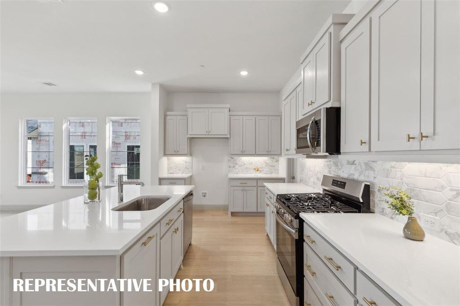 No shortage of style, prep or storage space in this over the top dream kitchen!  REPRESENTATIVE PHOTO