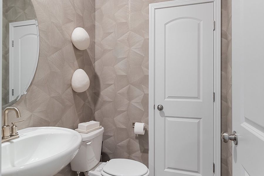 A bathroom with a shower and toilet.