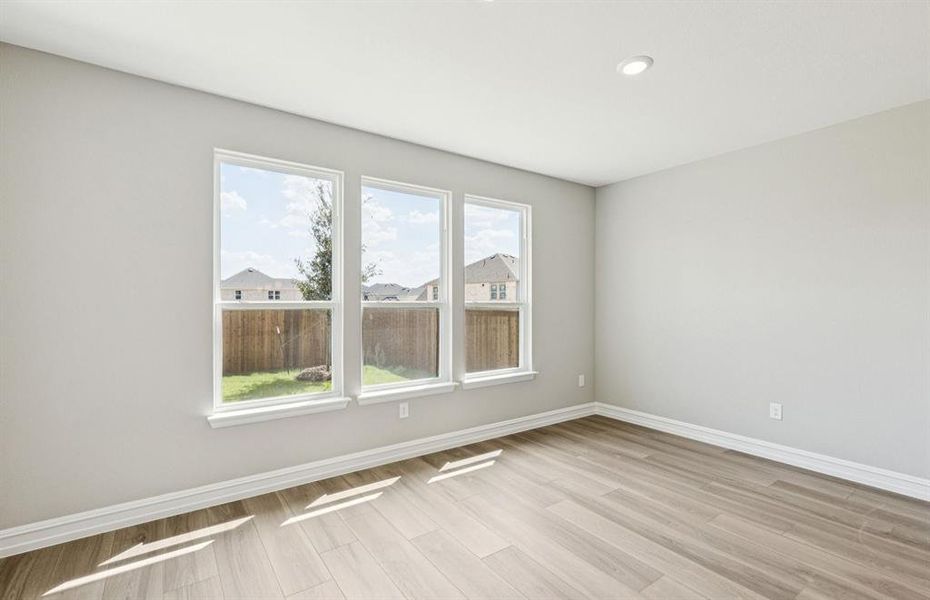 Formal dining room with large windows
