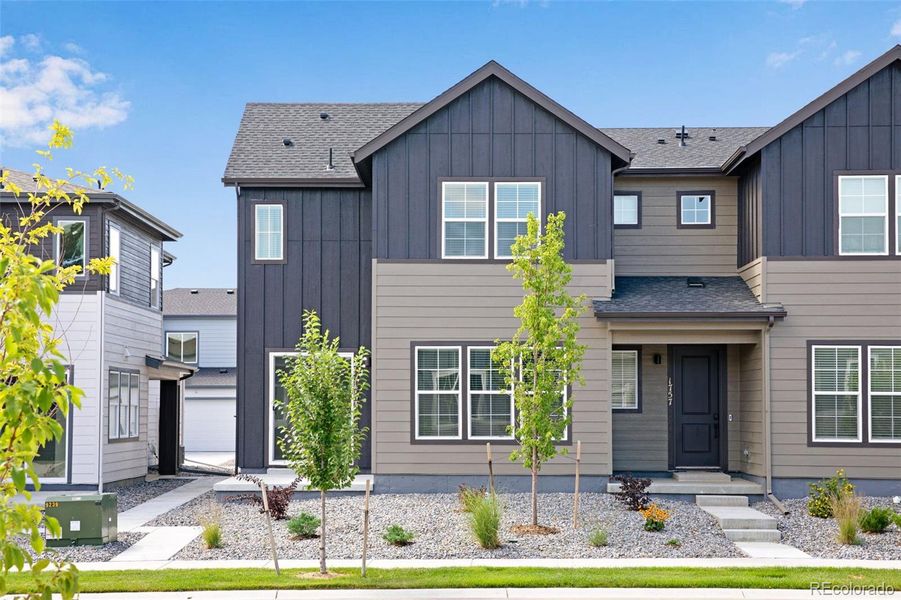 Front exterior of a new home in , Berthoud, CO, highlighting curb appeal (Image 25).