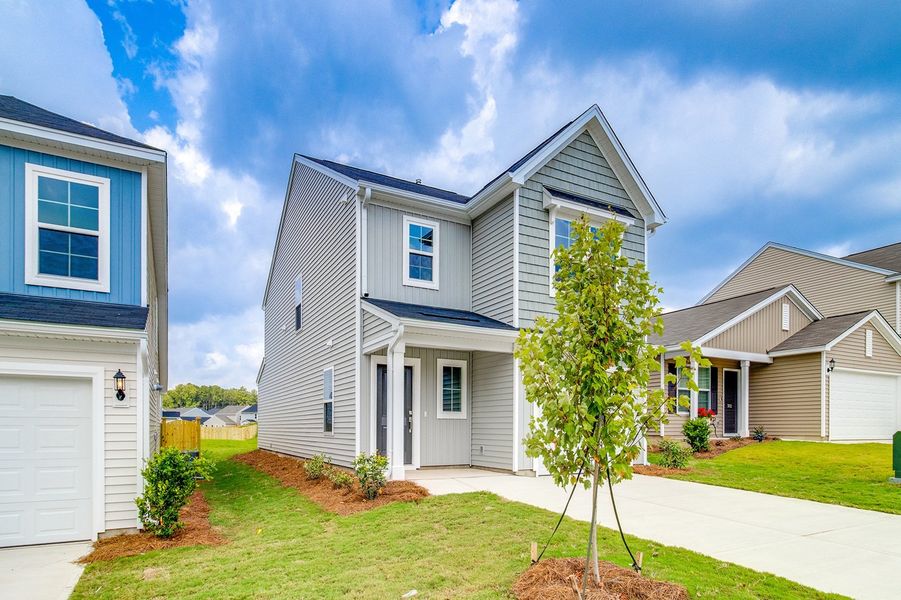 Front exterior of a new home in Bluefield, Lexington, SC, highlighting curb appeal (Image 19). Front exterior of a new home in Bluefield, Lexington, SC, highlighting curb appeal (Image 19).