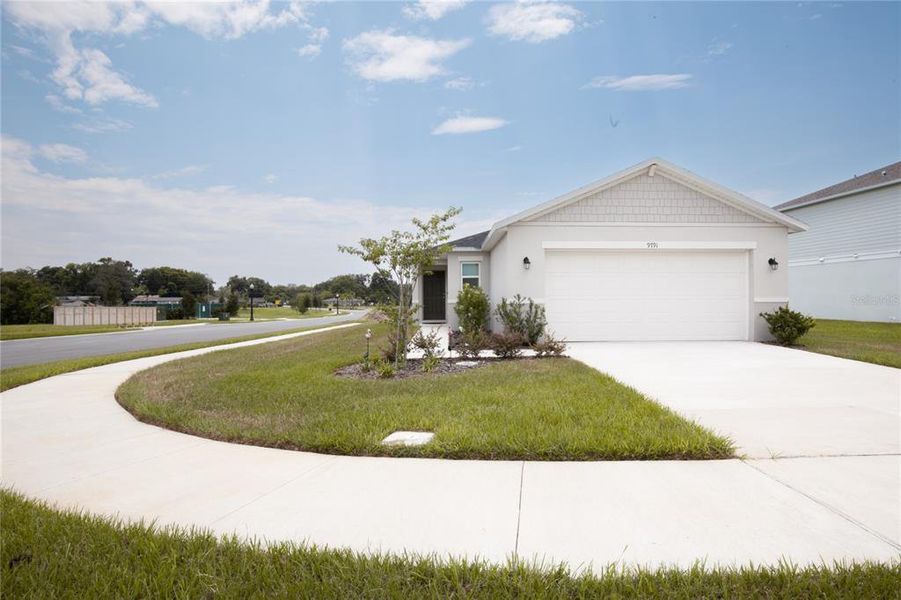 Front exterior of a new home in , Leesburg, FL, highlighting curb appeal (Image 2). Front exterior of a new home in , Leesburg, FL, highlighting curb appeal (Image 2).