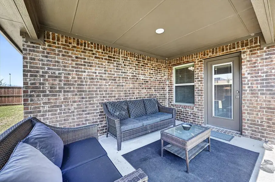 Exterior details and patio area of a home in Williamsburg, Fate (Image 3).
