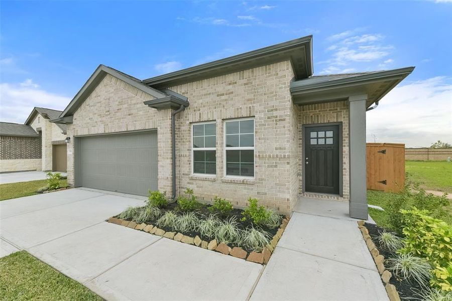 Front exterior of a new home in Emberly, Beasley, TX, highlighting curb appeal (Image 2). Front exterior of a new home in Emberly, Beasley, TX, highlighting curb appeal (Image 2).