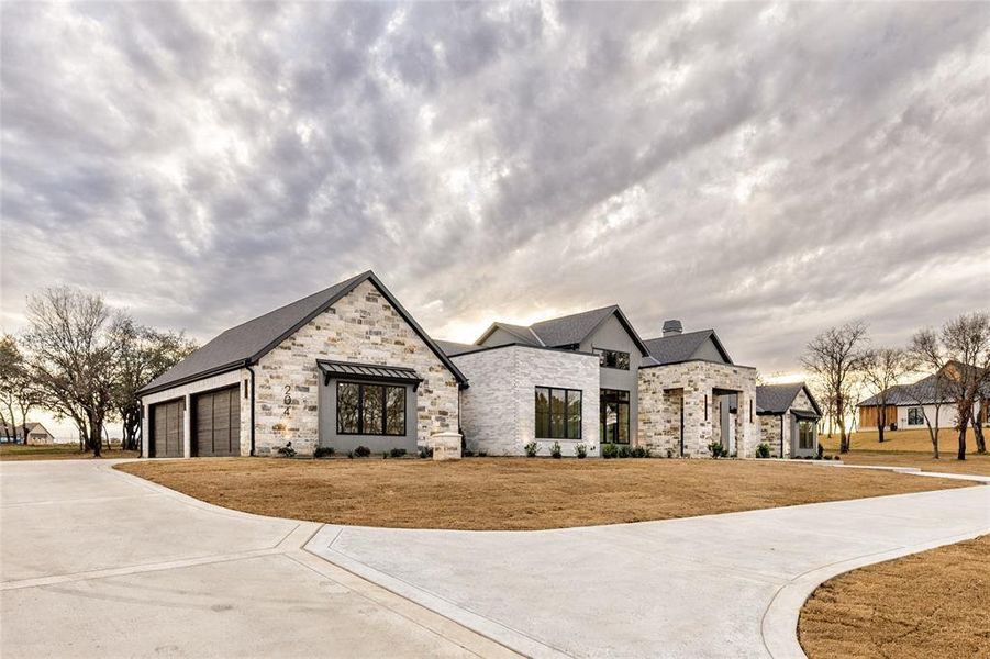 Front exterior of a new home in Santana Ridge, Weatherford, TX, highlighting curb appeal (Image 28).
