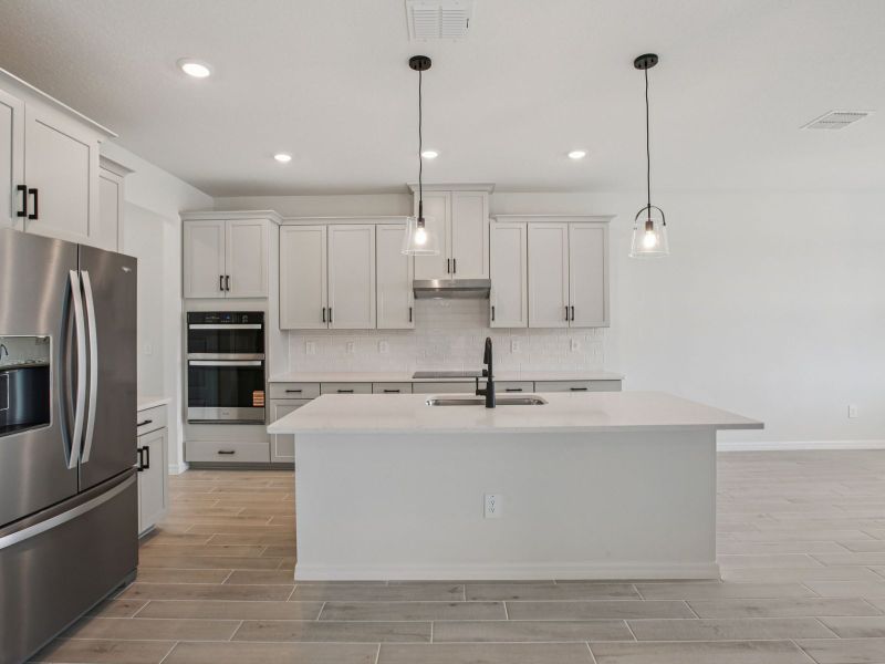 Furnished interior view inside a new home in The Grove at Stuart Crossing - Signature Series, Bartow (Image 4).