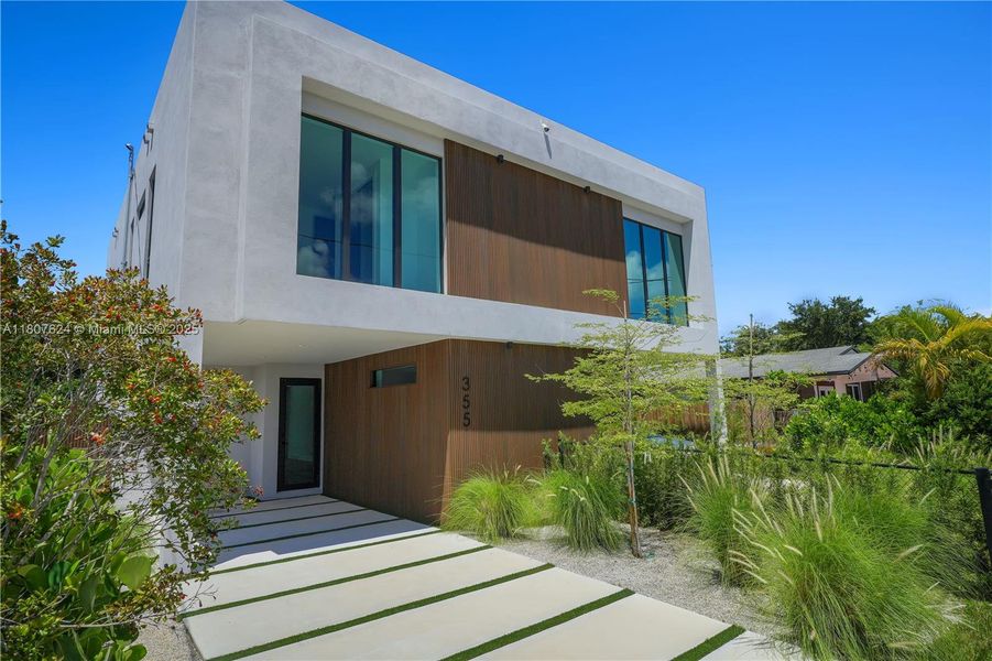 Front exterior of a new home in , Miami, FL, highlighting curb appeal (Image 1). Front exterior of a new home in , Miami, FL, highlighting curb appeal (Image 1).