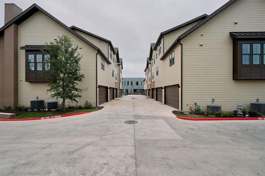 Townhome exterior featuring horizontal siding and dark trim accents Townhome exterior featuring horizontal siding and dark trim accents