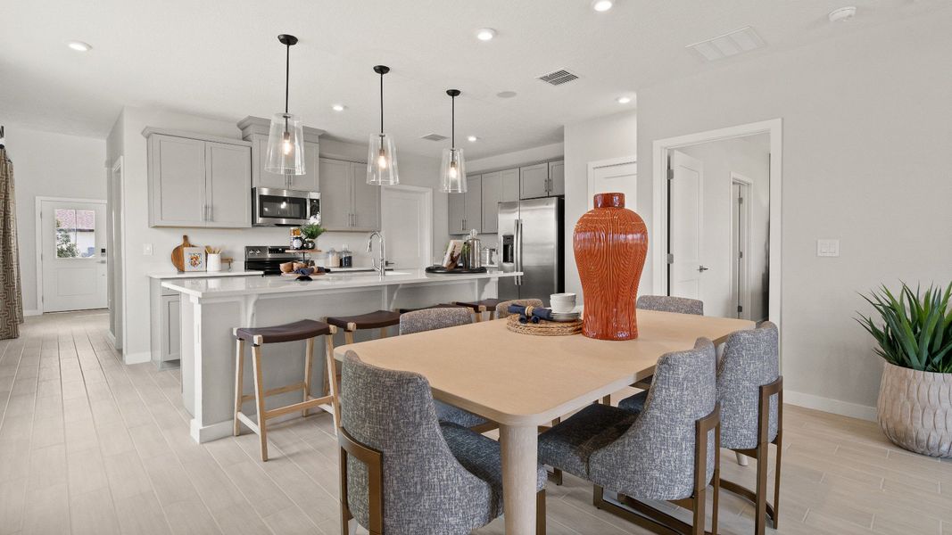 Jupiter Model Home Floor Plan Kitchen and Dining Area by DRB Homes, Available in Hamilton Bluff, Haines City, FL.