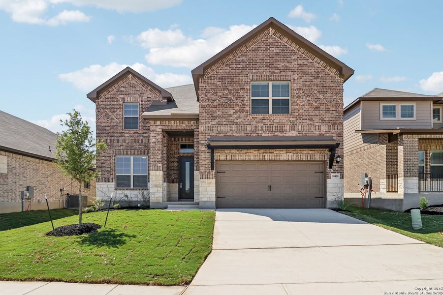 Front exterior of a new home in Fox Falls, Boerne, TX, highlighting curb appeal (Image 19).