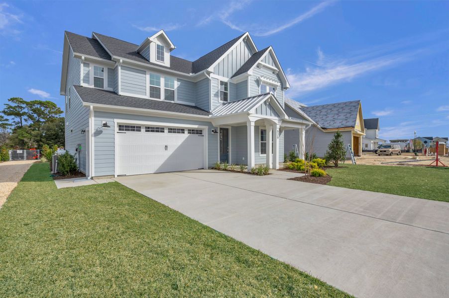 Representative exterior photo of a completed home built from the The Hampton by RobuckHomes in Windwater, Hampstead, NC (Image 30).