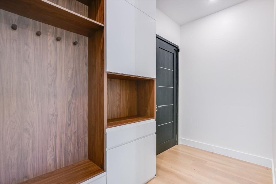 Mudroom with light wood-type flooring and baseboards Mudroom with light wood-type flooring and baseboards