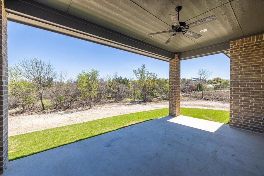 View of patio featuring ceiling fan