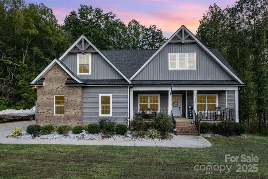 Front exterior of a new home in , Clover, SC, highlighting curb appeal (Image 25).