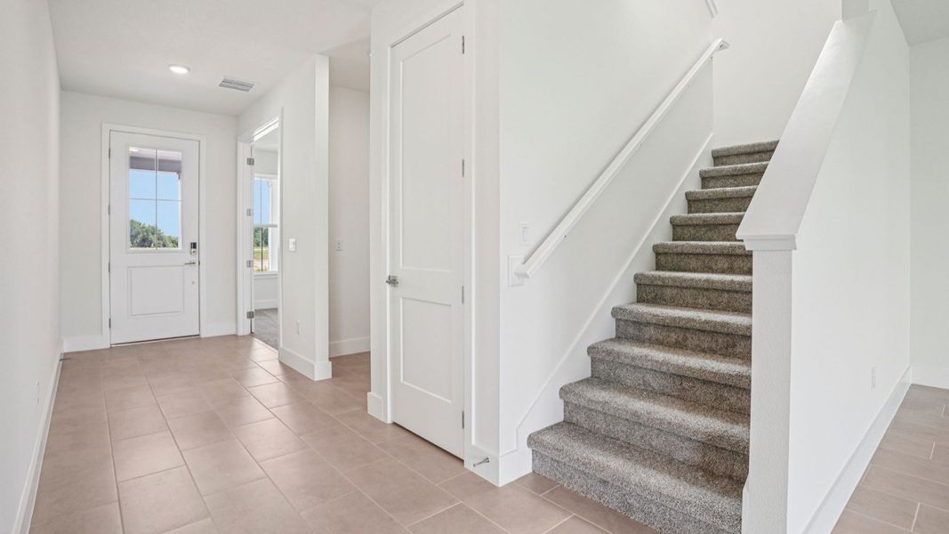 Plumeria Floor Plan interior entry by DRB Homes in Trailside located in Mount Dora, FL Plumeria Floor Plan interior entry by DRB Homes in Trailside located in Mount Dora, FL