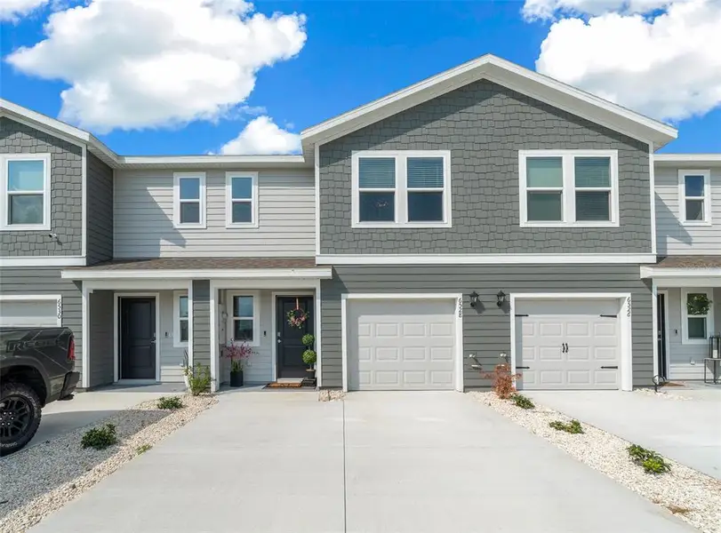 Front exterior of a new home in , Ocala, FL, highlighting curb appeal (Image 1). Front exterior of a new home in , Ocala, FL, highlighting curb appeal (Image 1).