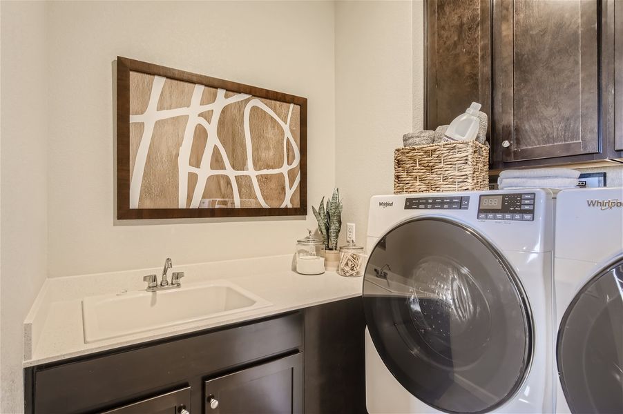 A bathroom with a washer and dryer. A bathroom with a washer and dryer.