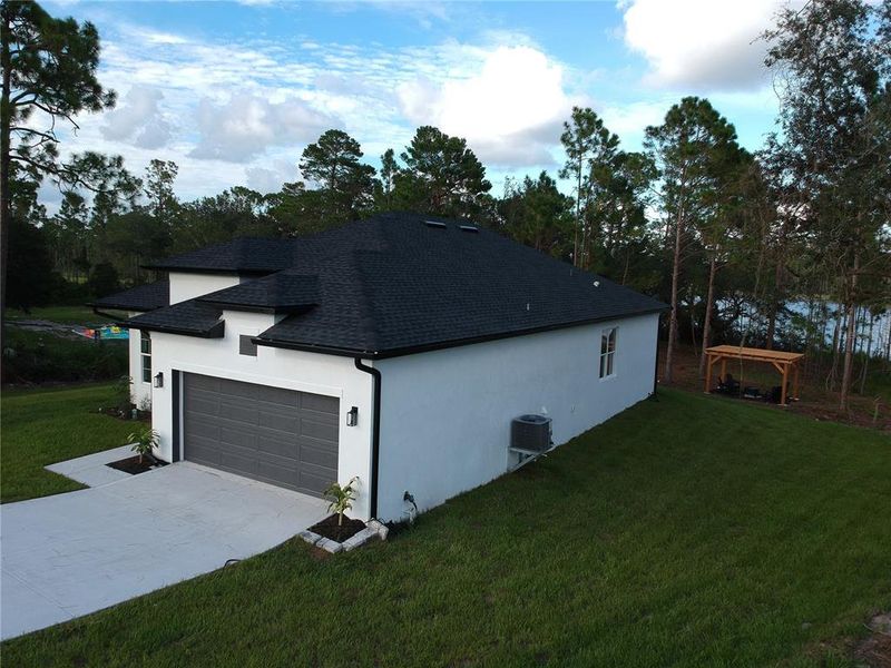Front exterior of a new home in , Deltona, FL, highlighting curb appeal (Image 23). Front exterior of a new home in , Deltona, FL, highlighting curb appeal (Image 23).