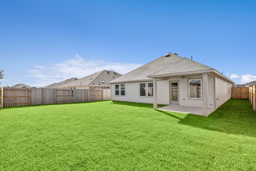 Exterior details and patio area of a home in Pinewood at Grand Texas, New Caney (Image 2).