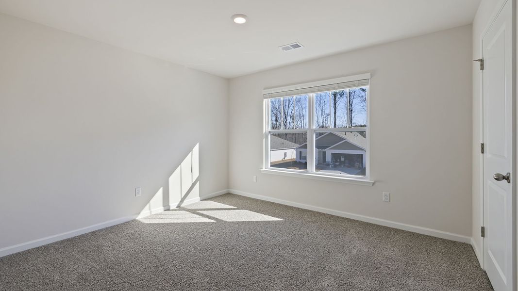 Spacious, unfurnished interior of a new home in Bentley Park, Greenwood (Image 28).