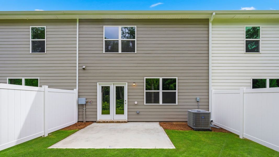 Exterior details and patio area of a home in Independence Villas and Townhomes, Loganville (Image 4).