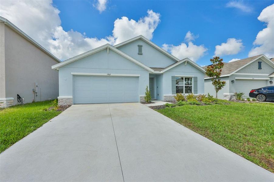 Front exterior of a new home in North Park Isle, Plant City, FL, highlighting curb appeal (Image 18). Front exterior of a new home in North Park Isle, Plant City, FL, highlighting curb appeal (Image 18).