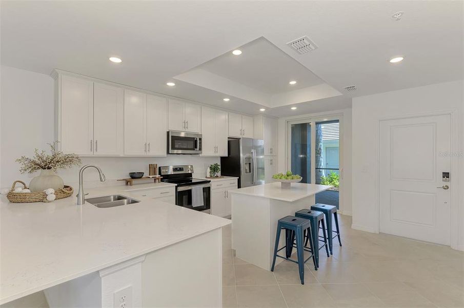 Furnished interior view inside a new home in Wellen Park Golf & Country Club, Venice (Image 10).