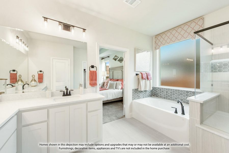 Master ensuite bathroom with double vanity, soaking tub, glass shower, and view into bedroom Master ensuite bathroom with double vanity, soaking tub, glass shower, and view into bedroom