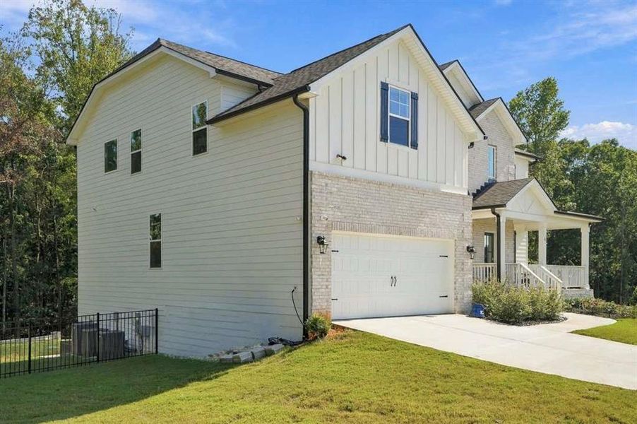 Front exterior of a new home in , Senoia, GA, highlighting curb appeal (Image 2). Front exterior of a new home in , Senoia, GA, highlighting curb appeal (Image 2).