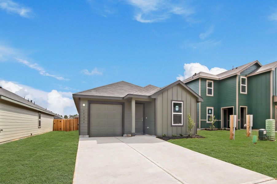 Front exterior of a new home in McCrorey Trails, Conroe, TX, highlighting curb appeal (Image 16).