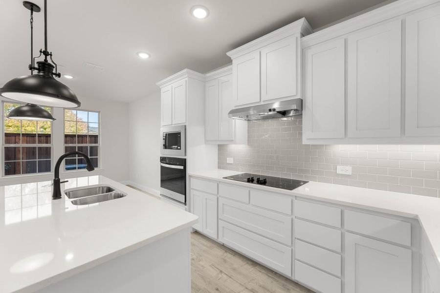 Front exterior of a new home in Main Street Village, Mansfield, TX, highlighting curb appeal (Image 7). Front exterior of a new home in Main Street Village, Mansfield, TX, highlighting curb appeal (Image 7).