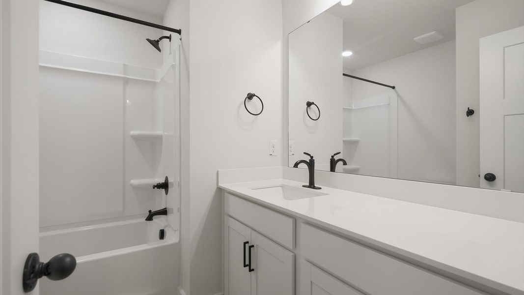 First-class guest bath featuring stylish fixtures and modern design elements