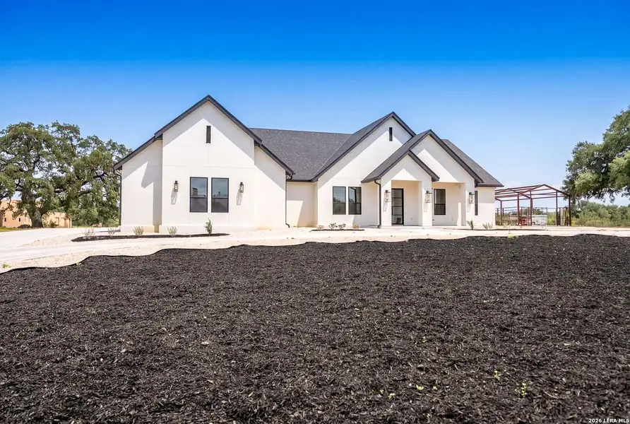 Front exterior of a new home in , Bandera, TX, highlighting curb appeal (Image 1). Front exterior of a new home in , Bandera, TX, highlighting curb appeal (Image 1).