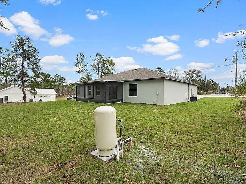Exterior details and patio area of a home in Royal Highlands, Brooksville (Image 25).