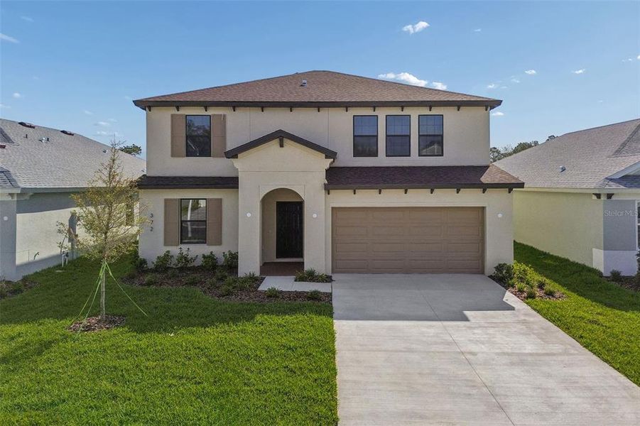 Front exterior of a new home in Avalon West, Spring Hill, FL, highlighting curb appeal (Image 29).