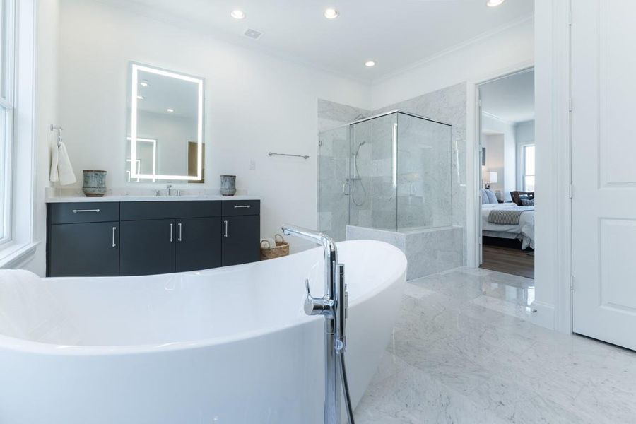 Separate vanities, LED mirrors, marble tiles, floating tub and a huge walk-in shower with bench seating.....2 walk in closets! Separate vanities, LED mirrors, marble tiles, floating tub and a huge walk-in shower with bench seating.....2 walk in closets!